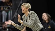 Iowa coach Jan Jensen cheers on her team against Oregon at Matthew Knight Arena Sunday, Jan. 19, 2025.