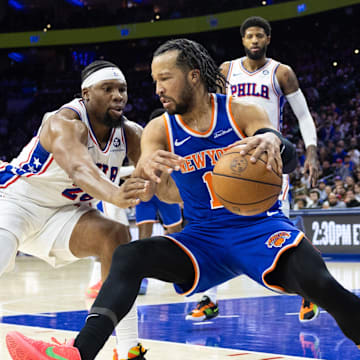 Jan 15, 2025; Philadelphia, Pennsylvania, USA; New York Knicks guard Jalen Brunson (11) controls the ball against Philadelphia 76ers forward Guerschon Yabusele (28) during the fourth quarter at Wells Fargo Center. Mandatory Credit: Bill Streicher-Imagn Images