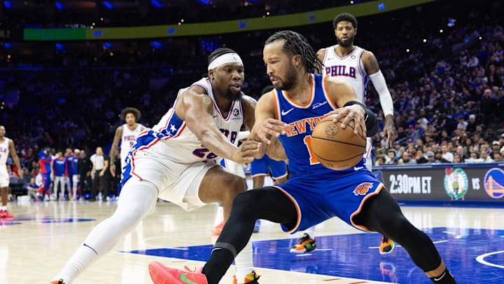 Jan 15, 2025; Philadelphia, Pennsylvania, USA; New York Knicks guard Jalen Brunson (11) controls the ball against Philadelphia 76ers forward Guerschon Yabusele (28) during the fourth quarter at Wells Fargo Center. Mandatory Credit: Bill Streicher-Imagn Images