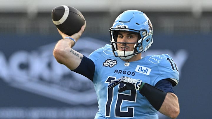 Jun 18, 2023; Toronto, Ontario, CAN;  Toronto Argonauts quarterback Chad Kelly (12) throws a pass against the Hamilton Tiger-Cats in the second quarter at BMO Field. Mandatory Credit: Dan Hamilton-Imagn Images