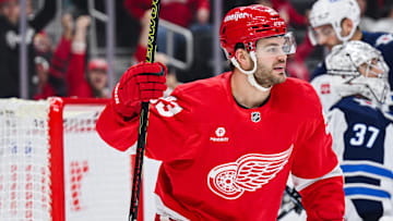 Oct 30, 2024; Detroit, Michigan, USA; Detroit Red Wings right wing Alex DeBrincat (93) celebrates center Dylan Larkin (not pictured) goal during the second period against the Winnipeg Jets at Little Caesars Arena. Mandatory Credit: Tim Fuller-Imagn Images
