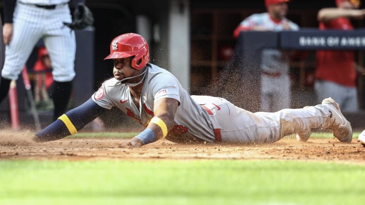 Sep 1, 2024; Bronx, New York, USA;  St. Louis Cardinals right fielder Jordan Walker (18) slides safely into home plate in the seventh inning against the New York Yankees at Yankee Stadium.