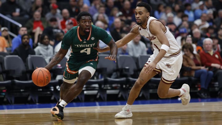 Mar 12, 2024; Washington, D.C., USA; Miami (Fl) Hurricanes guard Bensley Joseph (4) drives to the basket as Boston College Eagles guard Claudell Harris Jr. (1) defends in the first half at Capital One Arena. Mandatory Credit: Geoff Burke-USA TODAY Sports