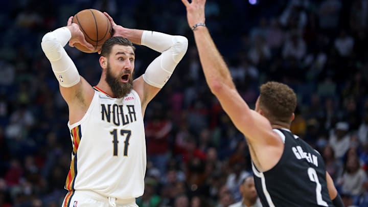 Nov 12, 2021; New Orleans, Louisiana, USA; New Orleans Pelicans center Jonas Valanciunas (17) yells while defended by Brooklyn Nets forward Blake Griffin (2) during the second half at the Smoothie King Center. Mandatory Credit: Chuck Cook-Imagn Images