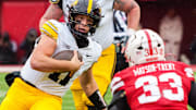 Iowa quarterback Mark Gronowski scrambles against Nebraska linebacker Marques Watson-Trent during the third quarter.