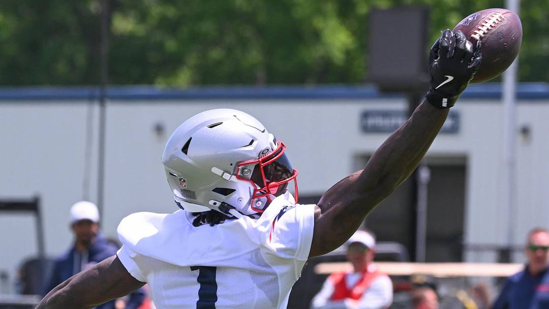 Jun 2, 2026; Foxborough, MA, USA; New England Patriots wide receiver A.J. Brown (1) reaches out for the ball during the team's OTA at Gillette Stadium. Mandatory Credit: Eric Canha-Imagn Images