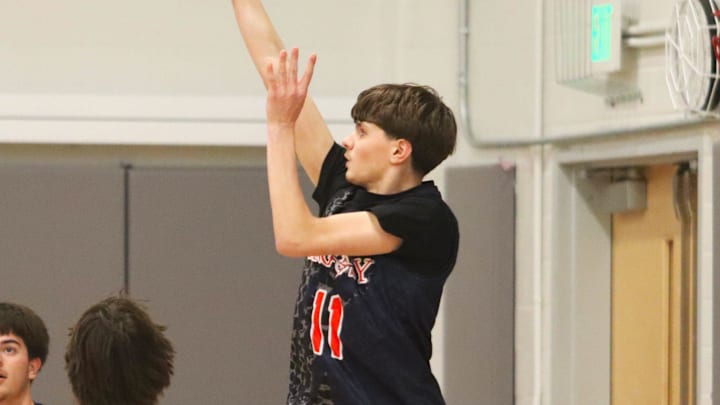 Argosy Collegiate Charter's Tristen DeOliveira shoots a 3-pointer during an MIAA-MCSAO crossover game against Bristol Aggie on Dec. 13, 2024.