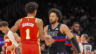 Jan 22, 2025; Atlanta, Georgia, USA; Detroit Pistons guard Cade Cunningham (2) and Atlanta Hawks forward Jalen Johnson (1) react after the Pistons defeated the Hawks at State Farm Arena. Mandatory Credit: Dale Zanine-Imagn Images