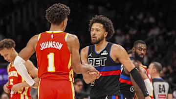 Jan 22, 2025; Atlanta, Georgia, USA; Detroit Pistons guard Cade Cunningham (2) and Atlanta Hawks forward Jalen Johnson (1) react after the Pistons defeated the Hawks at State Farm Arena. Mandatory Credit: Dale Zanine-Imagn Images