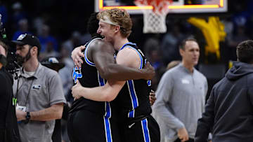 BYU Cougars center Fousseyni Traore and forward Richie Saunders react on Mar 22, 2025.