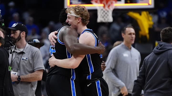 BYU Cougars center Fousseyni Traore and forward Richie Saunders react on Mar 22, 2025.