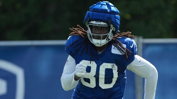 Colts tight end Jelani Woods (blue jersey with white sleeves) runs a route during practice in Westfield, Indiana. 