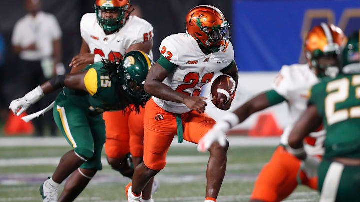 Florida A&M running back Thad Franklin, Jr. (23) breaks away from Norfolk State linebacker AJ Richardson (15) during the Cricket MEAC-SWAC Challenge NCAA college football game against Norfolk State in Atlanta on Saturday, Aug. 24, 2024.