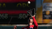 Mar 9, 2025; Tempe, Arizona, USA; Cincinnati Reds outfielder Stuart Fairchild (17) makes the running catch for an out against the Los Angeles Angels in the third inning at Tempe Diablo Stadium. Mandatory Credit: Rick Scuteri-Imagn Images