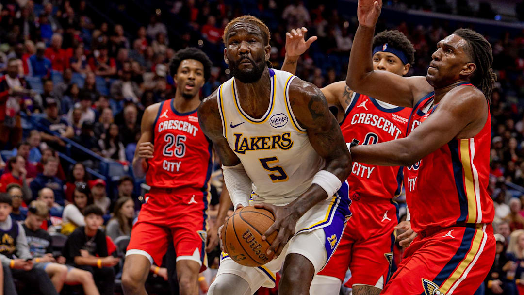 Nov 14, 2025; New Orleans, Louisiana, USA; Los Angeles Lakers center Deandre Ayton (5) dribbles against New Orleans Pelicans guard Jeremiah Fears (0) during the first half at Smoothie King Center. Mandatory Credit: Stephen Lew-Imagn Images Nov 14, 2025; New Orleans, Louisiana, USA; Los Angeles Lakers center Deandre Ayton (5) dribbles against New Orleans Pelicans guard Jeremiah Fears (0) during the first half at Smoothie King Center. Mandatory Credit: Stephen Lew-Imagn Images