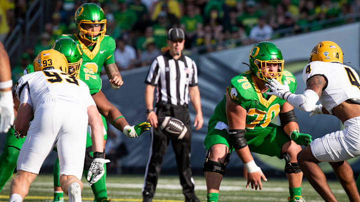 Oregon Ducks offensive lineman Charlie Pickard snaps the ball to Oregon Ducks quarterback Dillon Gabriel as the Oregon Ducks host the Idaho Vandals Saturday, Aug. 31, 2024 at Autzen Stadium in Eugene, Ore.