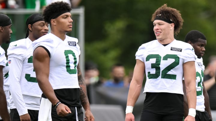 Jul 25, 2024; Florham Park, NJ, USA; New York Jets running back Isaiah Davis (32) chats with running back Braelon Allen (0) during training camp at Atlantic Health Jets Training Center. 