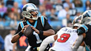 Dec 26, 2021; Charlotte, North Carolina, USA;  Carolina Panthers quarterback Cam Newton (1) looks to pass as Tampa Bay Buccaneers outside linebacker Joe Tryon-Shoyinka (9) pressures in the third quarter at Bank of America Stadium. Mandatory Credit: Bob Donnan-Imagn Images