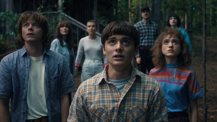 (L to R) Charlie Heaton as Jonathan Byers, Winona Ryder as Joyce Byers, Millie Bobby Brown as Eleven, Noah Schnapp as Will Byers, David Harbour as Jim Hopper, Natalia Dyer as Nancy Wheeler, and Finn Wolfhard as Mike Wheeler in Stranger Things season 4