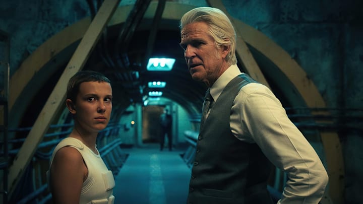 STRANGER THINGS. (L to R) Millie Bobby Brown as Eleven and Matthew Modine as Dr. Martin Brenner in STRANGER THINGS. Cr. Courtesy of Netflix © 2022