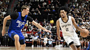 Jul 12, 2025; Las Vegas, NV, USA; Dallas Mavericks forward Cooper Flagg (32) defends against San Antonio Spurs guard Dylan Harper (2) in the second quarter of their game at Thomas & Mack Center. Mandatory Credit: Candice Ward-Imagn Images
