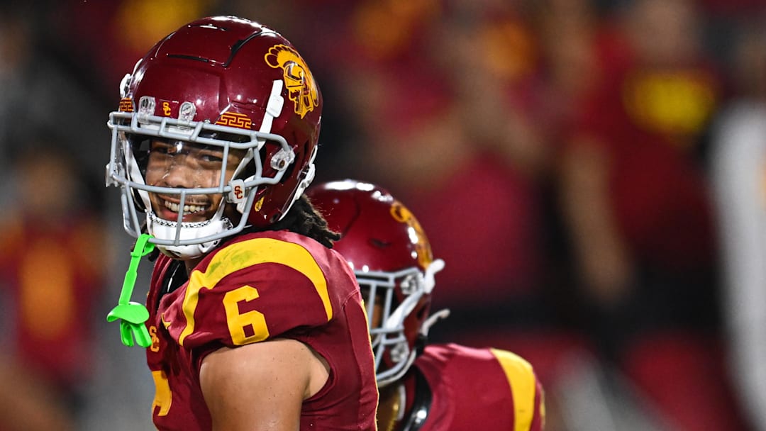 Sep 7, 2024; Los Angeles, California, USA; USC Trojans wide receiver Makai Lemon (6) celebrates after scoring a touchdown against the Utah State Aggies during the second quarter at United Airlines Field at Los Angeles Memorial Coliseum. Mandatory Credit: Jonathan Hui-Imagn Images