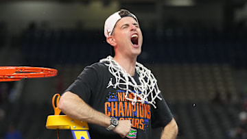Apr 7, 2025; San Antonio, TX, USA;  Florida Gators head coach Todd Golden celebrates as he cuts down the net after defeating the Houston Cougars in the national championship game of the Final Four of the 2025 NCAA Tournament at the Alamodome. Mandatory Credit: Robert Deutsch-Imagn Images