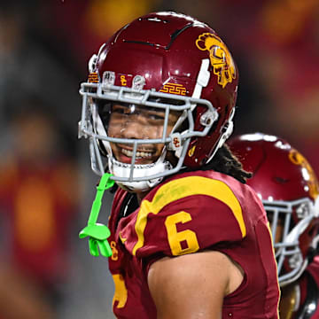 Sep 7, 2024; Los Angeles, California, USA; USC Trojans wide receiver Makai Lemon (6) celebrates after scoring a touchdown against the Utah State Aggies during the second quarter at United Airlines Field at Los Angeles Memorial Coliseum. Mandatory Credit: Jonathan Hui-Imagn Images