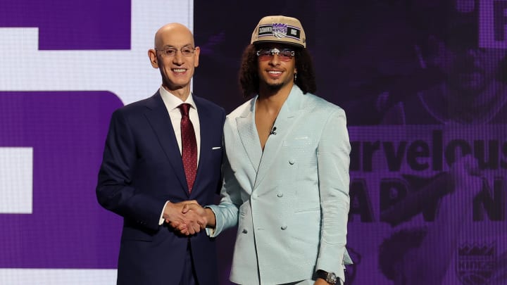 Jun 26, 2024; Brooklyn, NY, USA; Devin Carter poses for photos with NBA commissioner Adam Silver after being selected in the first round by the Sacramento Kings in the 2024 NBA Draft at Barclays Center. Mandatory Credit: Brad Penner-USA TODAY Sports