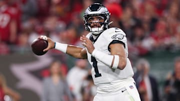 Philadelphia Eagles quarterback Jalen Hurts (1) throws against the Tampa Bay Buccaneers during the first half of a 2024 NFC wild card game at Raymond James Stadium.