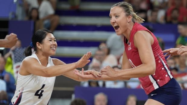 United States outside hitter Jordan Larson (10) and United States libero Justine Wong-Orantes (4) celebrate against Italy in 