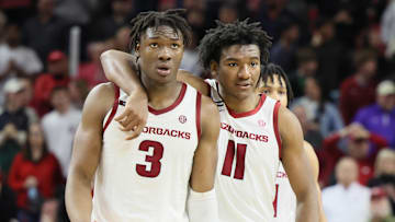 Jan 22, 2025; Fayetteville, Arkansas, USA; Arkansas Razorbacks forwards Adou Thiero (3) and Karter Knox (11) celebrate after a play int he second half against the Georgia Bulldogs at Bud Walton Arena. Arkansas won 68-65. Mandatory Credit: Nelson Chenault-Imagn Images