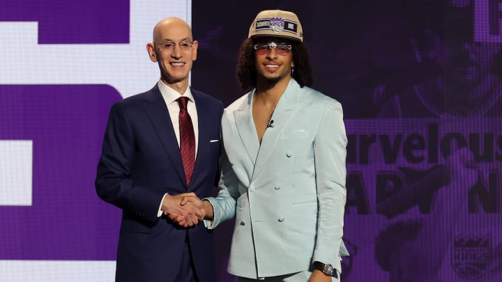 Jun 26, 2024; Brooklyn, NY, USA; Devin Carter poses for photos with NBA commissioner Adam Silver after being selected in the first round by the Sacramento Kings in the 2024 NBA Draft at Barclays Center. Mandatory Credit: Brad Penner-USA TODAY Sports