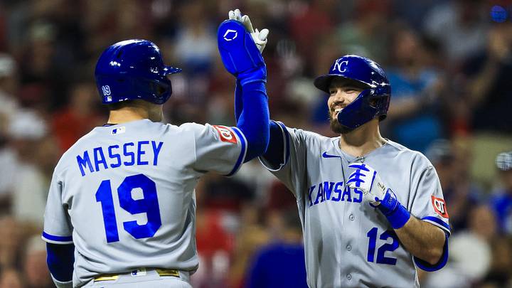 Kansas City Royals third baseman Nick Loftin (12) high-fives second baseman Michael Massey (19).