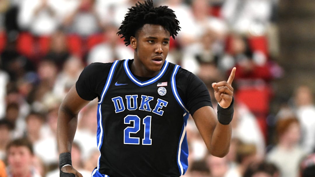 Mar 2, 2026; Raleigh, North Carolina, USA;  Duke Blue Devils center Patrick Ngongba II (21) reacts after scoring against the NC State Wolfpack during the first half at Lenovo Center. Mandatory Credit: Zachary Taft-Imagn Images