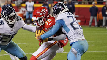 Nov 6, 2022; Kansas City, Missouri, USA; Kansas City Chiefs wide receiver Kadarius Toney (19) runs the ball as Tennessee Titans cornerback Kristian Fulton (26) makes the tackle during the second half of the game at GEHA Field at Arrowhead Stadium. Mandatory Credit: Denny Medley-Imagn Images