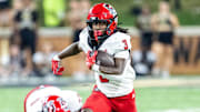 Sep 11, 2025; Winston-Salem, North Carolina, USA;  North Carolina State Wolfpack running back Hollywood Smothers (3) runs the ball in the first half against the Wake Forest Demon Deacons at Allegacy Federal Credit Union Stadium. Mandatory Credit: Luke Jamroz-Imagn Images