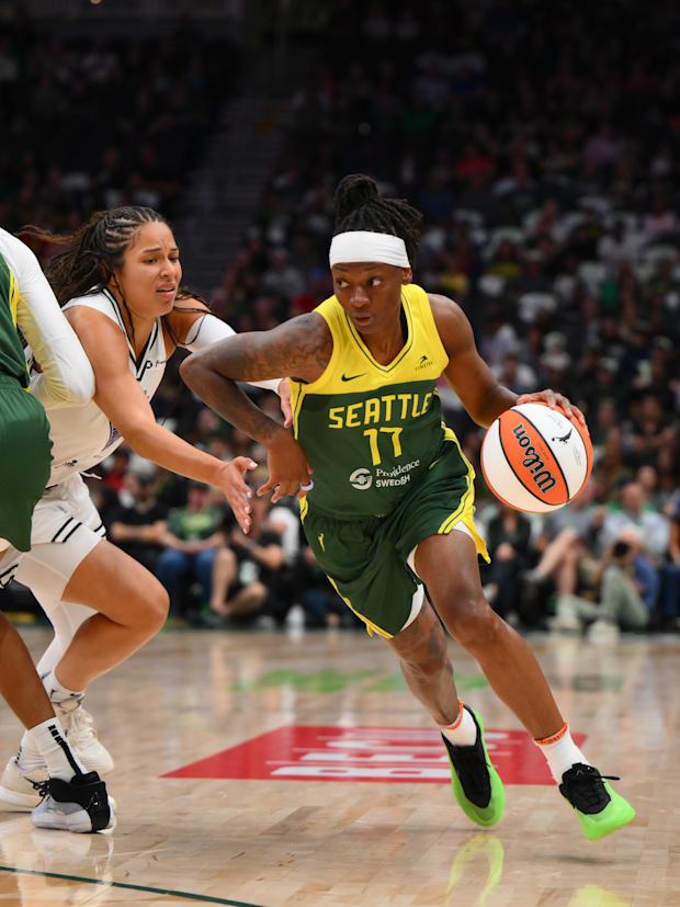 Seattle Storm guard Erica Wheeler advances the ball while defended by Golden State Valkyries guard Veronica Burton. 