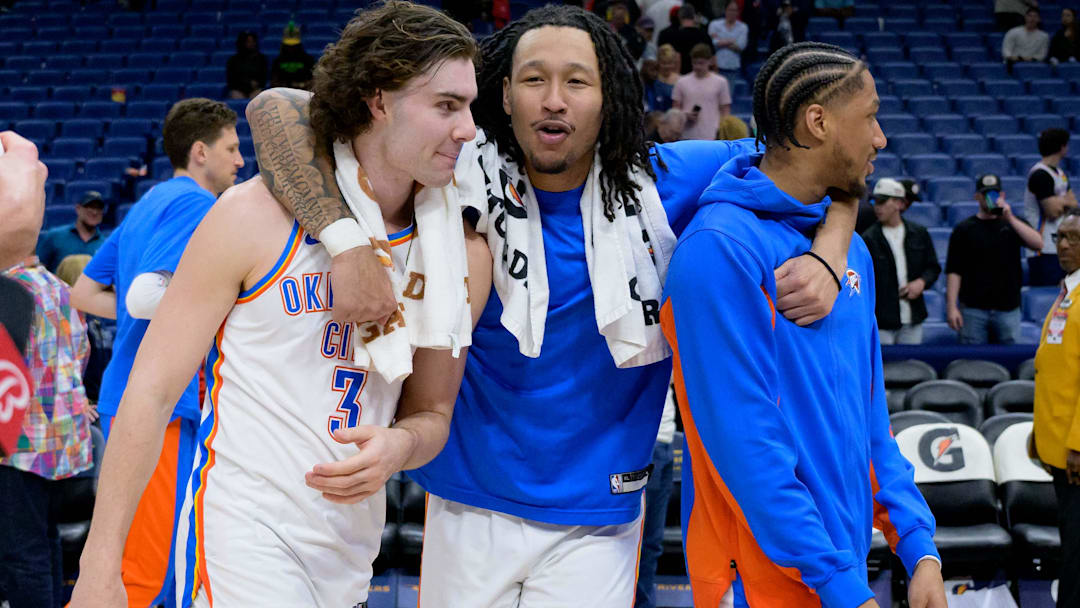 Mar 26, 2024; New Orleans, Louisiana, USA; Oklahoma City Thunder guard Josh Giddey (3), left, forward Jaylin Williams, and guard Aaron Wiggins celebrate after their victory over the against the New Orleans Pelicans at Smoothie King Center. Mandatory Credit: Matthew Hinton-Imagn Images