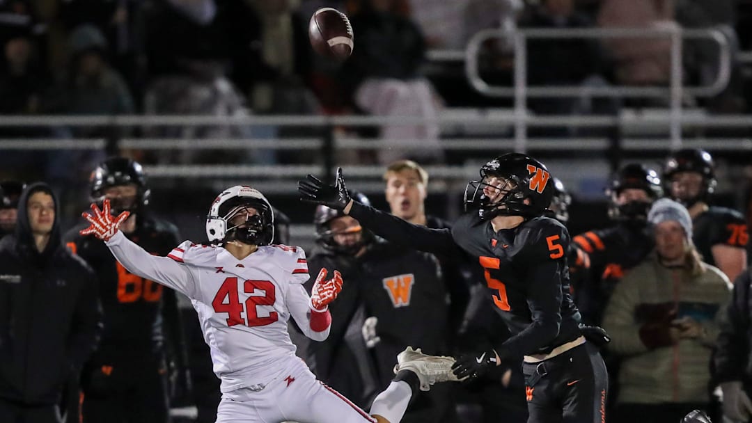West De Pere High School's Nolan Sell (5) breaks up a pass intended for Union Grove High School's Nathan Tucker (42) during a WIAA Division 2 state quarterfinal on Friday, November 7, 2025, at West De Pere High School in De Pere, Wis. De Pere won the game, 42-14.
Tork Mason/USA TODAY NETWORK-Wisconsin