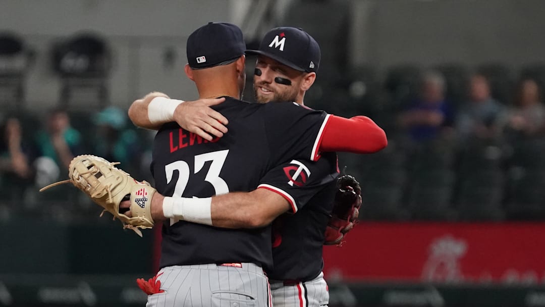 Sep 23, 2025; Arlington, Texas, USA; Minnesota Twins third baseman Royce Lewis (23) and second baseman Kody Clemens (18) hug following a game against the Texas Rangers at Globe Life Field. Mandatory Credit: Raymond Carlin III-Imagn Images Sep 23, 2025; Arlington, Texas, USA; Minnesota Twins third baseman Royce Lewis (23) and second baseman Kody Clemens (18) hug following a game against the Texas Rangers at Globe Life Field. Mandatory Credit: Raymond Carlin III-Imagn Images