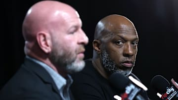 Apr 13, 2025; Portland, Oregon, USA;  Portland Trail Blazers head coach Chauncey Billups (right) listens to Trail Blazers’ general manager Joe Cronin answer a question during a press conference before Portland plays their last season game against Los Angeles Lakers at Moda Center. Mandatory Credit: Jaime Valdez-Imagn Images