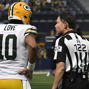 Oct 6, 2024; Inglewood, California, USA; Green Bay Packers quarterback Jordan Love (10) talks to referee Brad Allen before an NFL game against the Los Angeles Rams at SoFi Stadium. Mandatory Credit: Robert Hanashiro-Imagn Images