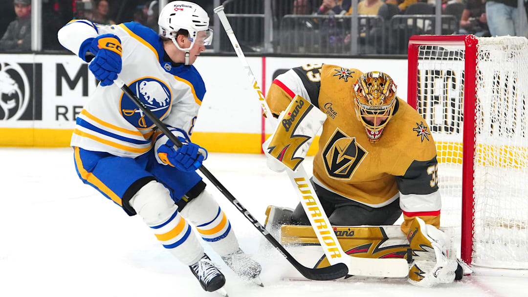 Mar 17, 2026; Las Vegas, Nevada, USA; Vegas Golden Knights goaltender Adin Hill (33) makes a save against Buffalo Sabres center Noah Ostlund (86) during the first period at T-Mobile Arena. Mandatory Credit: Stephen R. Sylvanie-Imagn Images