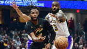 Nov 25, 2023; Cleveland, Ohio, USA; Cleveland Cavaliers guard Darius Garland (10) passes as Los Angeles Lakers forward LeBron James (23) defends during the first half at Rocket Mortgage FieldHouse. Mandatory Credit: Ken Blaze-USA TODAY Sports