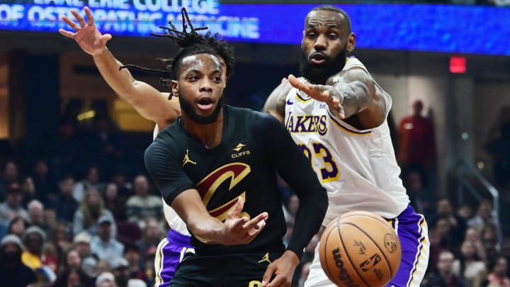 Nov 25, 2023; Cleveland, Ohio, USA; Cleveland Cavaliers guard Darius Garland (10) passes as Los Angeles Lakers forward LeBron James (23) defends during the first half at Rocket Mortgage FieldHouse. Mandatory Credit: Ken Blaze-USA TODAY Sports