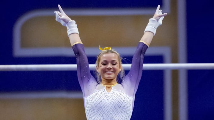 LSU Lady Tigers senior Livvy Dunne performs a demonstration uneven bars routine against the Arkansas Razorbacks.