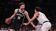 Apr 13, 2025; Brooklyn, New York, USA; Brooklyn Nets forward Drew Timme (26) is guarded by New York Knicks forward Kevin McCullar Jr. (9) during the second half at Barclays Center. Mandatory Credit: Vincent Carchietta-Imagn Images