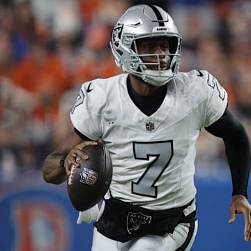 Nov 6, 2025; Denver, Colorado, USA; Las Vegas Raiders quarterback Geno Smith (7) drops back to pass against the Denver Broncos during the first half at Empower Field at Mile High. Mandatory Credit: Isaiah J. Downing-Imagn Images