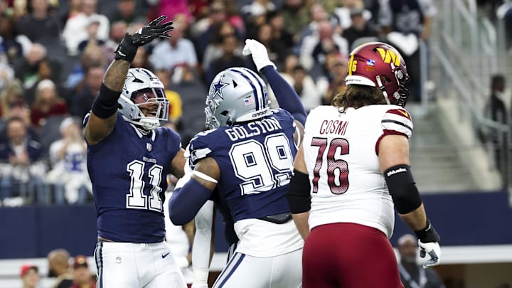 Dallas Cowboys linebacker Micah Parsons (11) celebrates with Dallas Cowboys defensive end Chauncey Golston